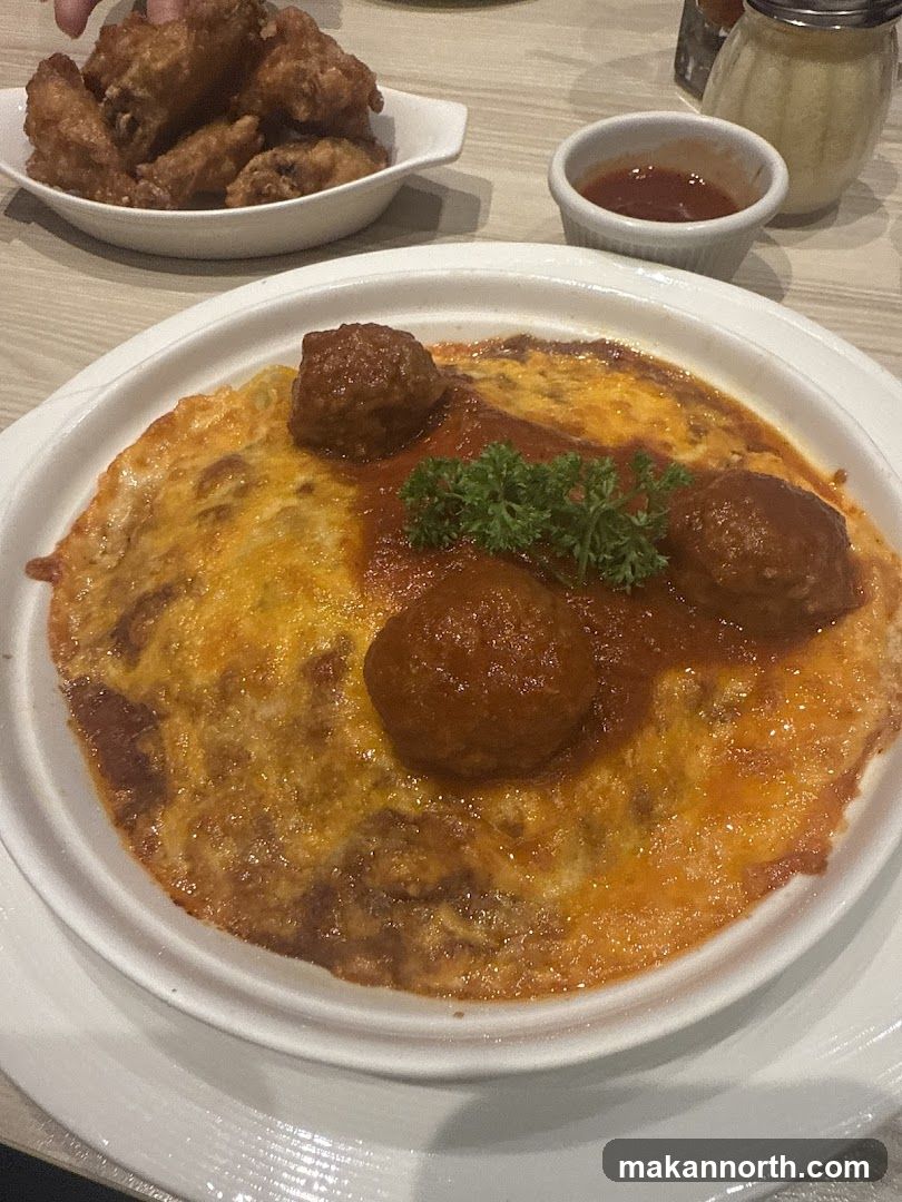 Baked Dish with Meatballs and Chicken Wings