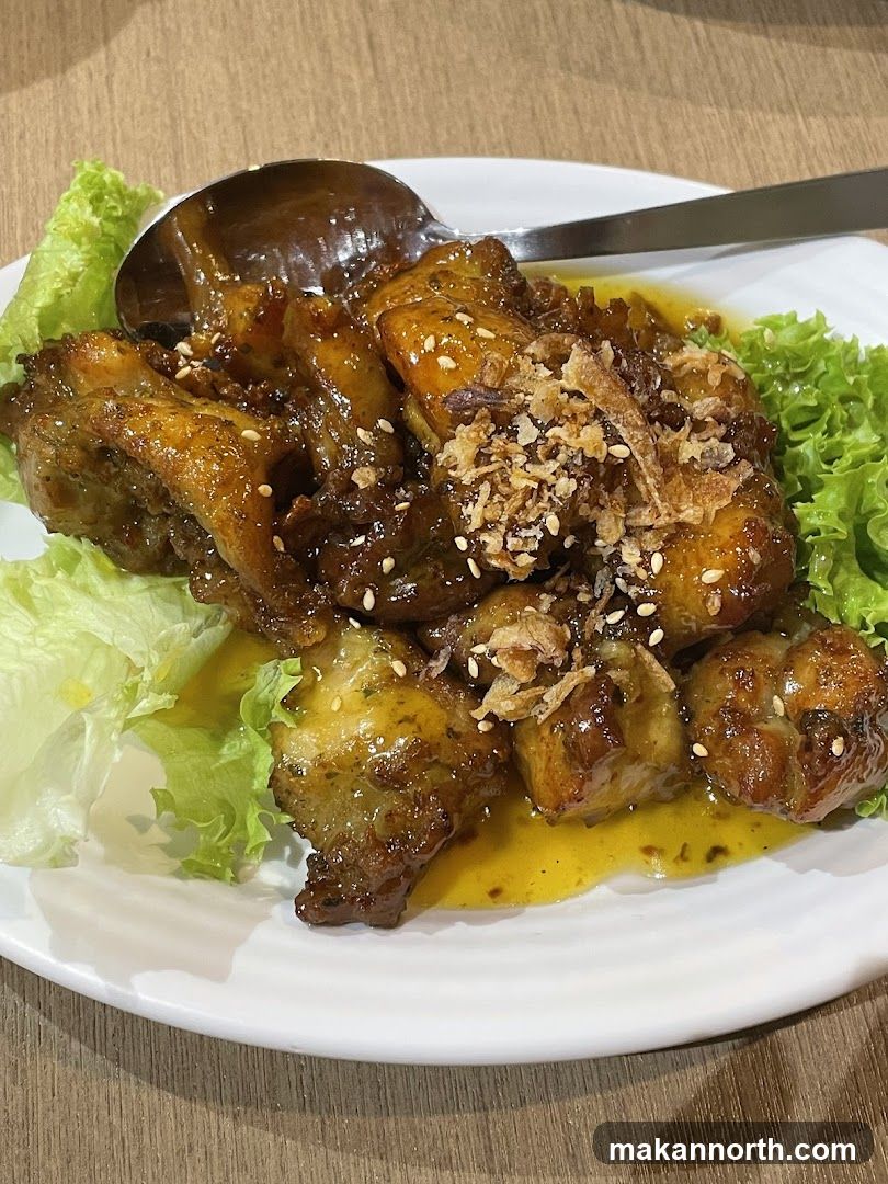 Chicken dish with lettuce and spoon