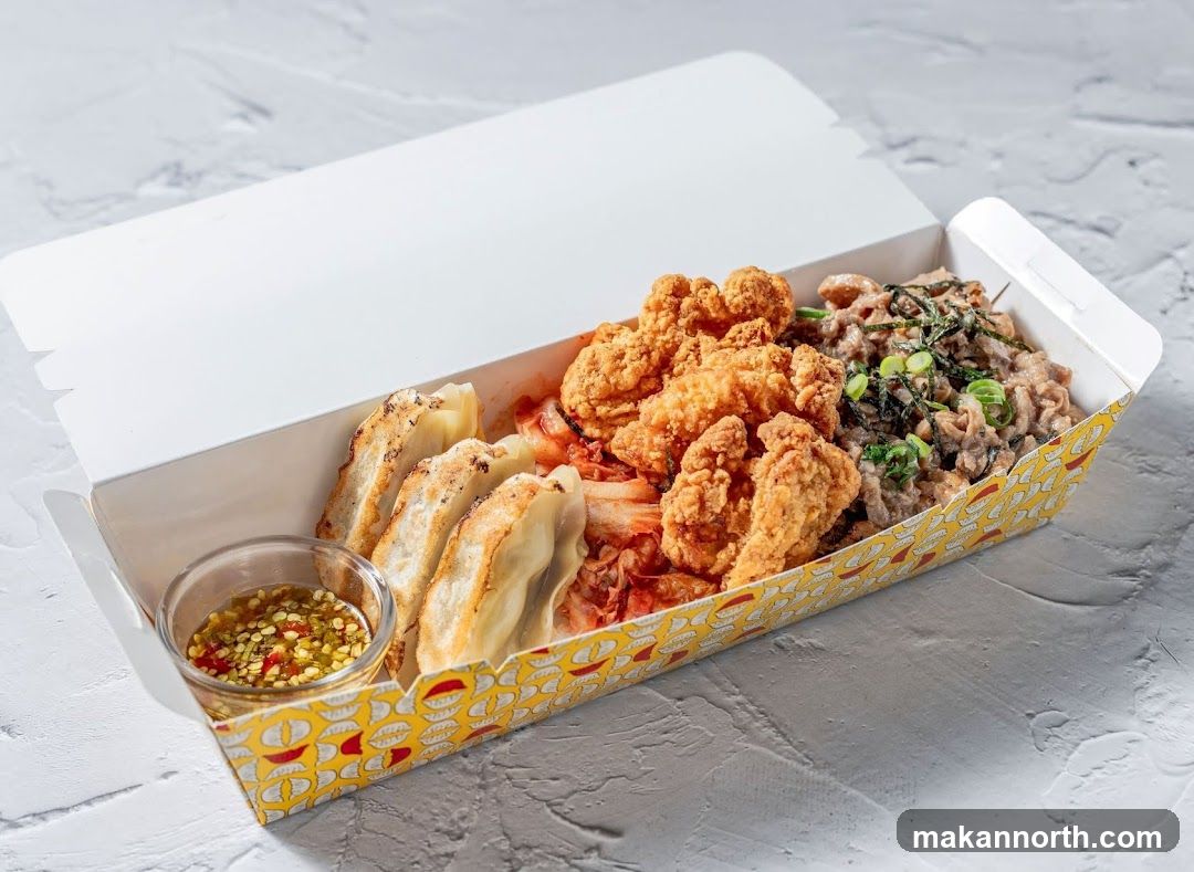 Takeout Box with Fried Chicken, Gyoza, and Beef