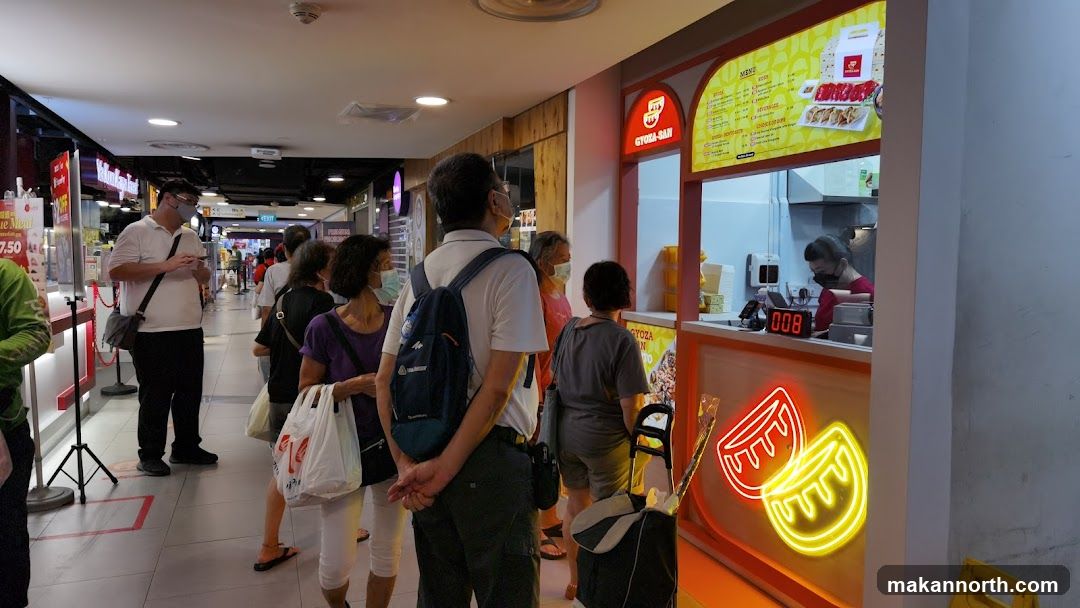 People in Line at a Food Stall