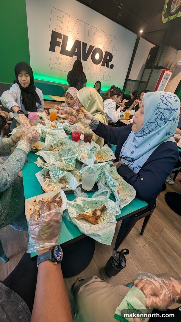 People eating chicken wings