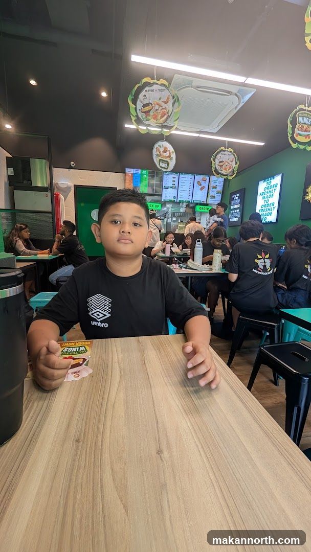 Boy at a restaurant table