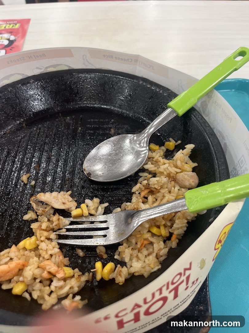 Sizzling Plate with Leftover Rice and Corn