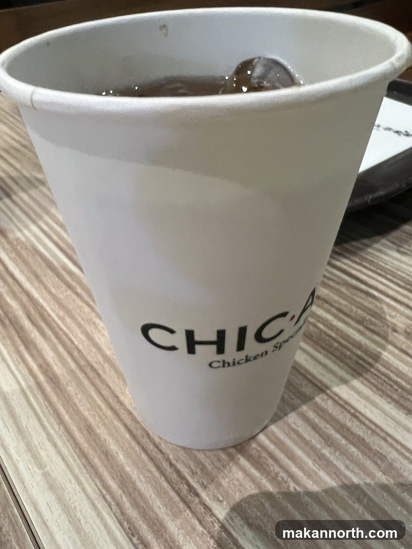 Beverage in a branded cup