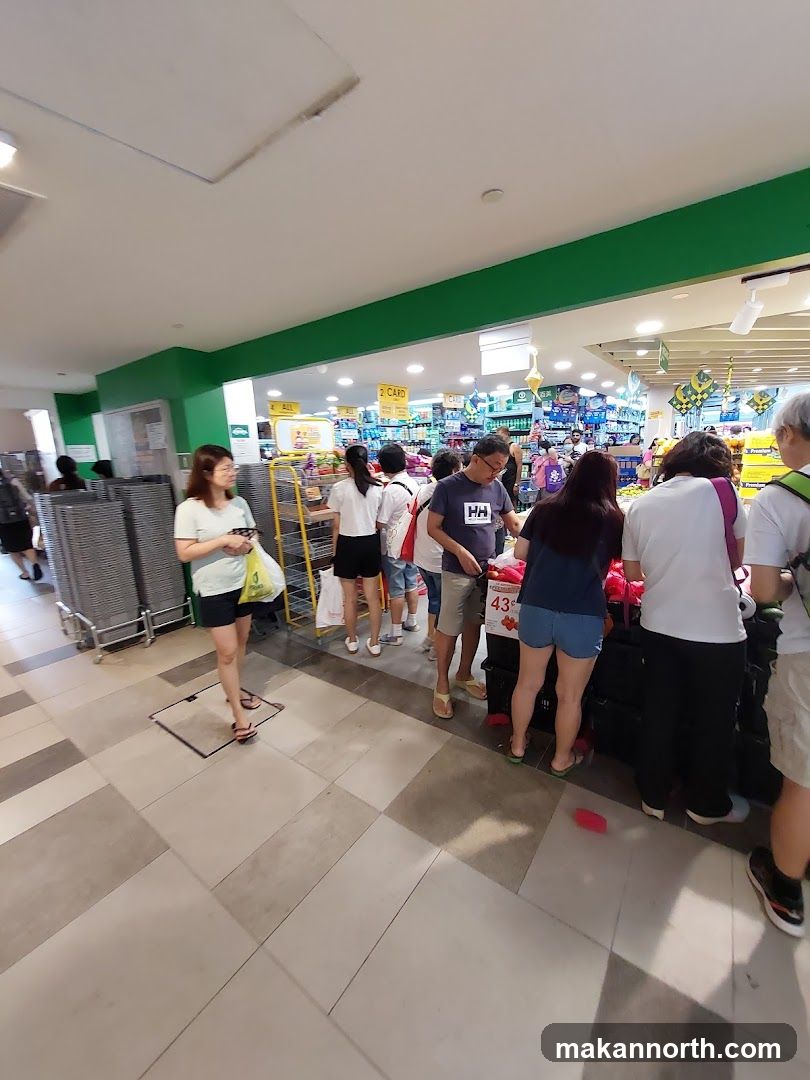 Supermarket aisle with shoppers