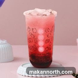 Red beverage with cartoon characters