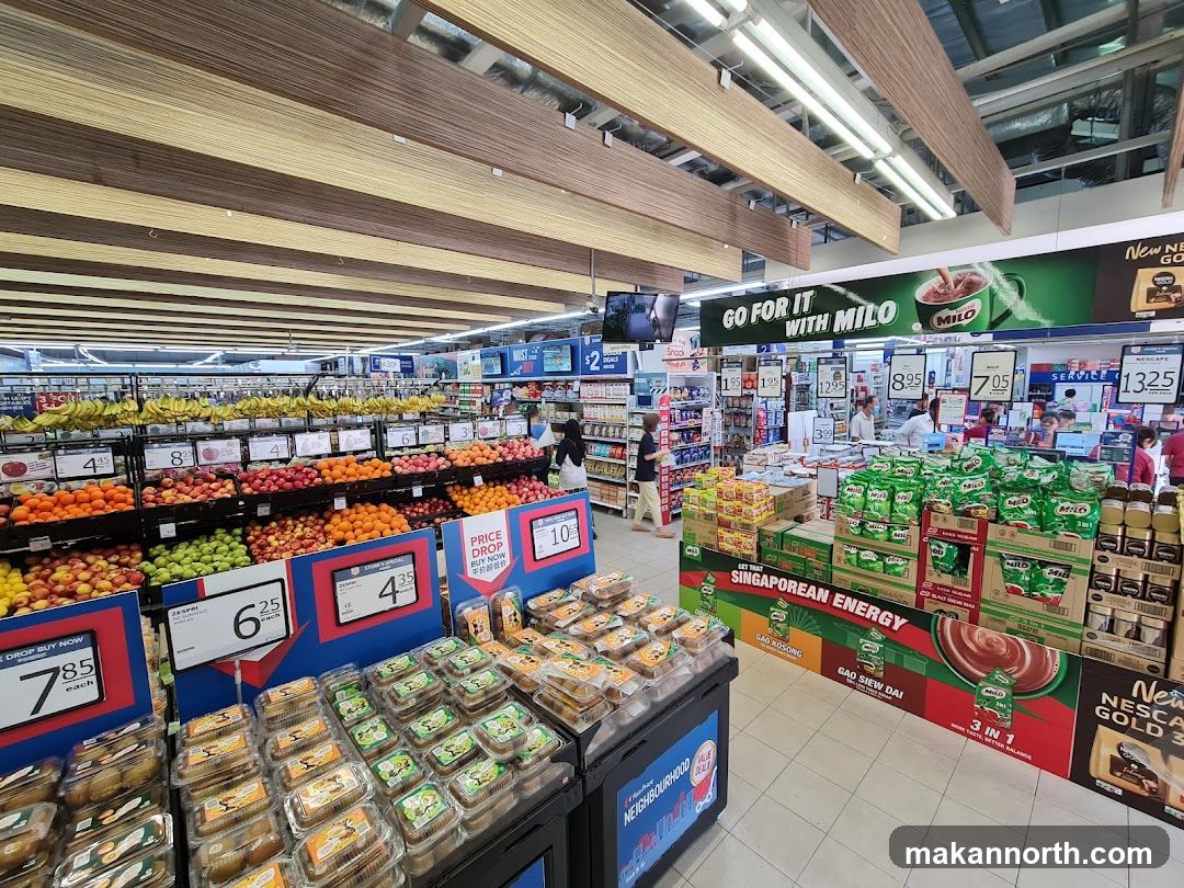 Supermarket aisle with fruits and beverages