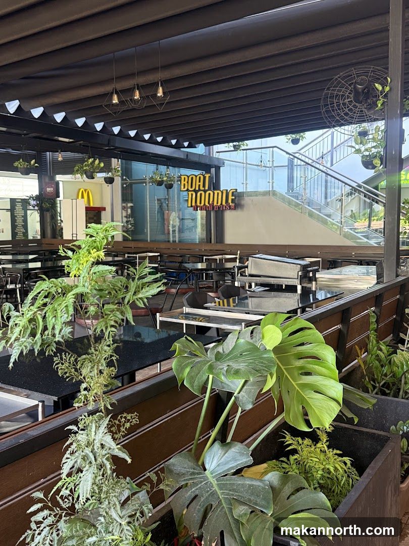 Outdoor Seating Area with Plants and Signage