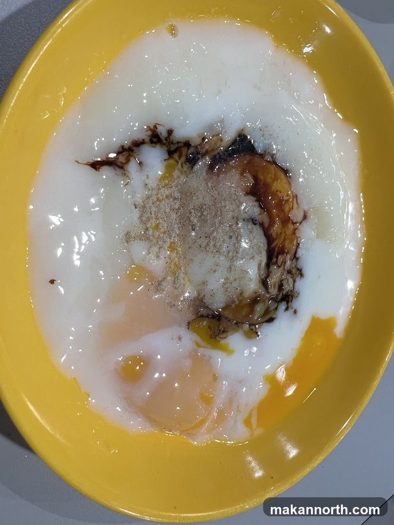 Soft-boiled eggs with soy sauce and pepper