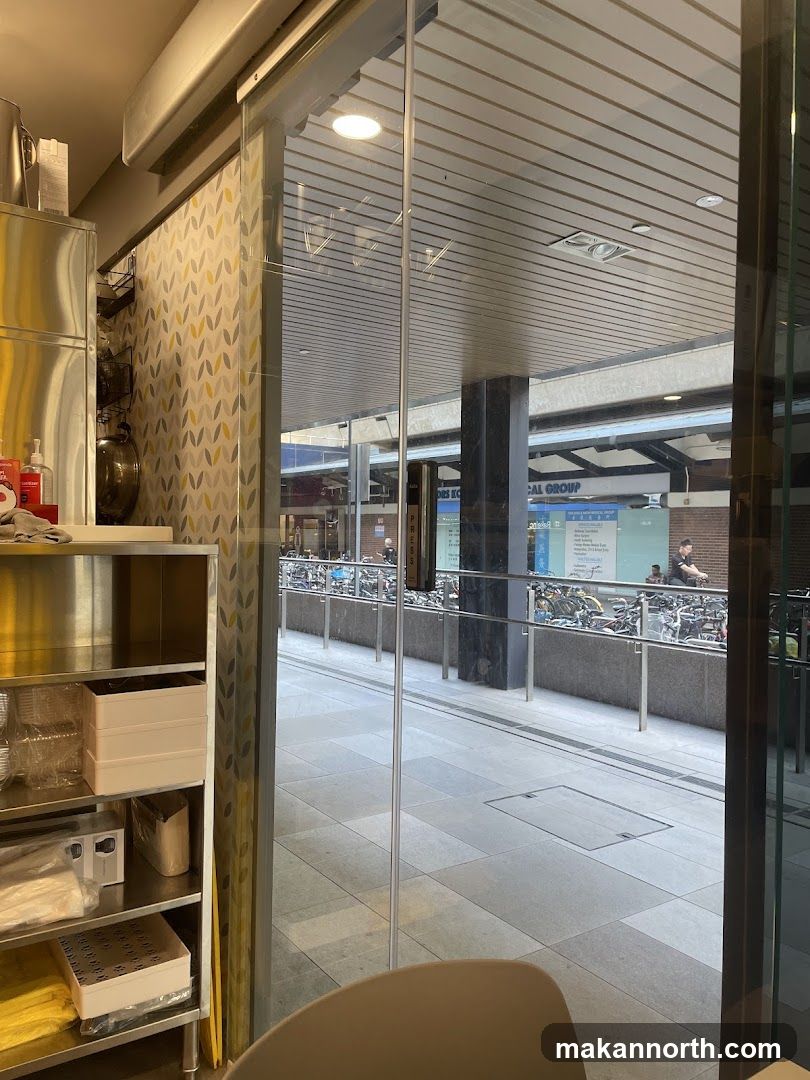 View through glass doors to outdoor walkway