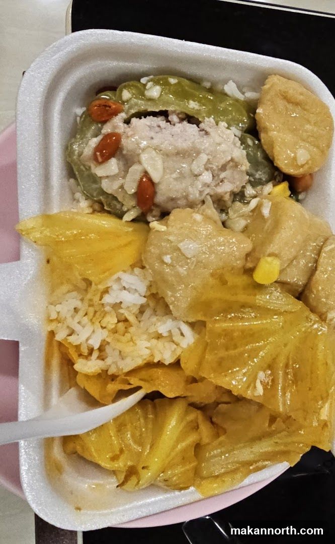 Styrofoam container with rice and food