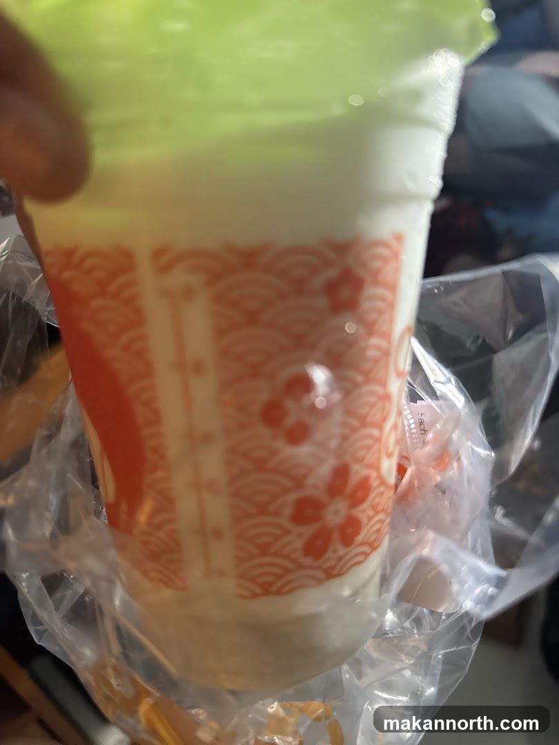 Drink in a cup with a patterned sleeve
