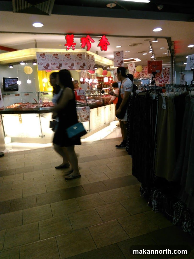 Store Interior with Food Display and Clothing Racks