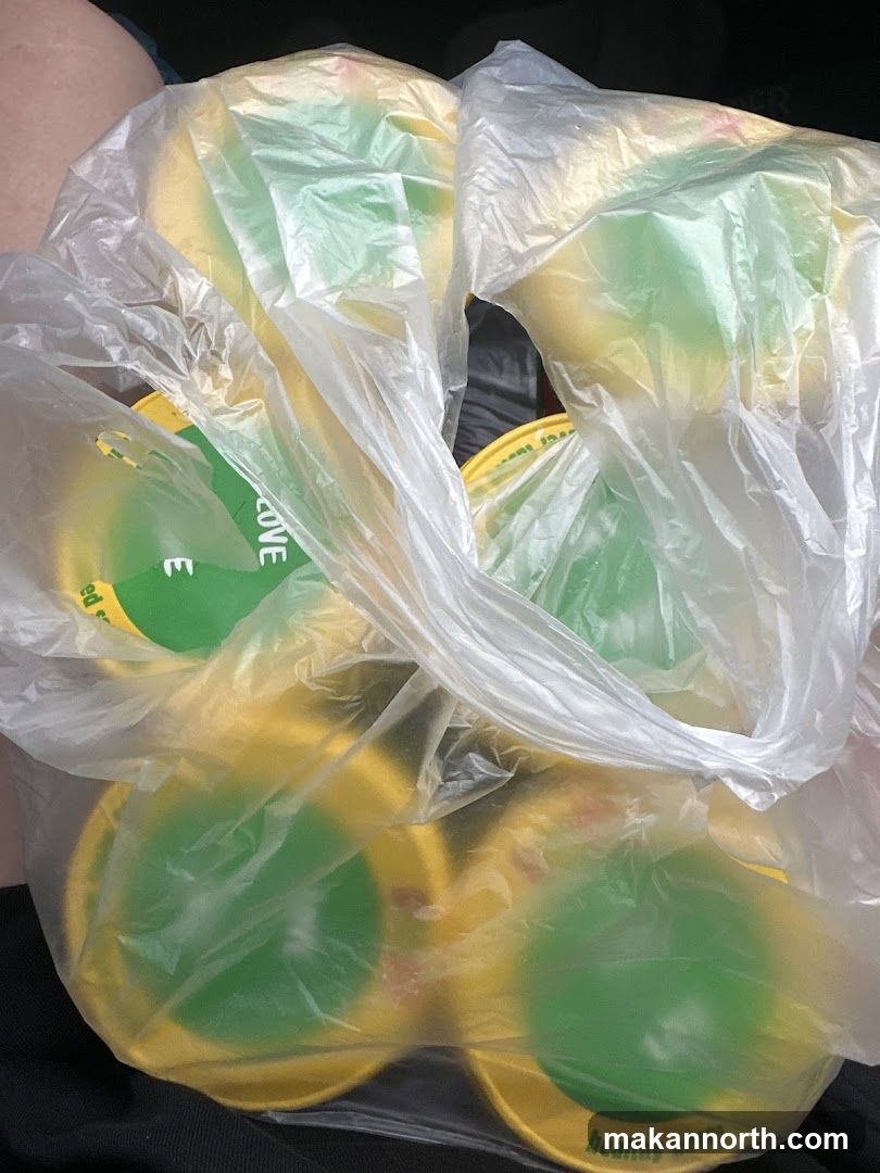 Yellow and green containers in a plastic bag