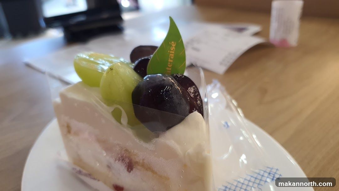 Slice of cake with grapes