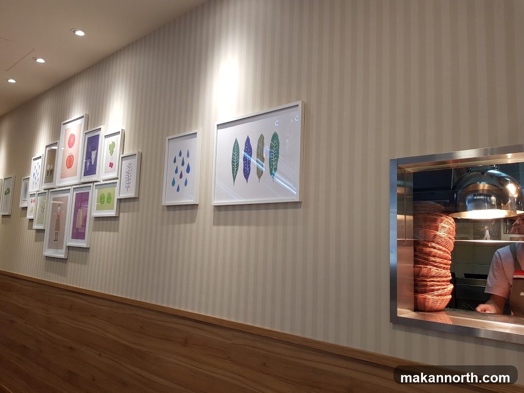 Restaurant Interior with Artwork and Food Preparation Area