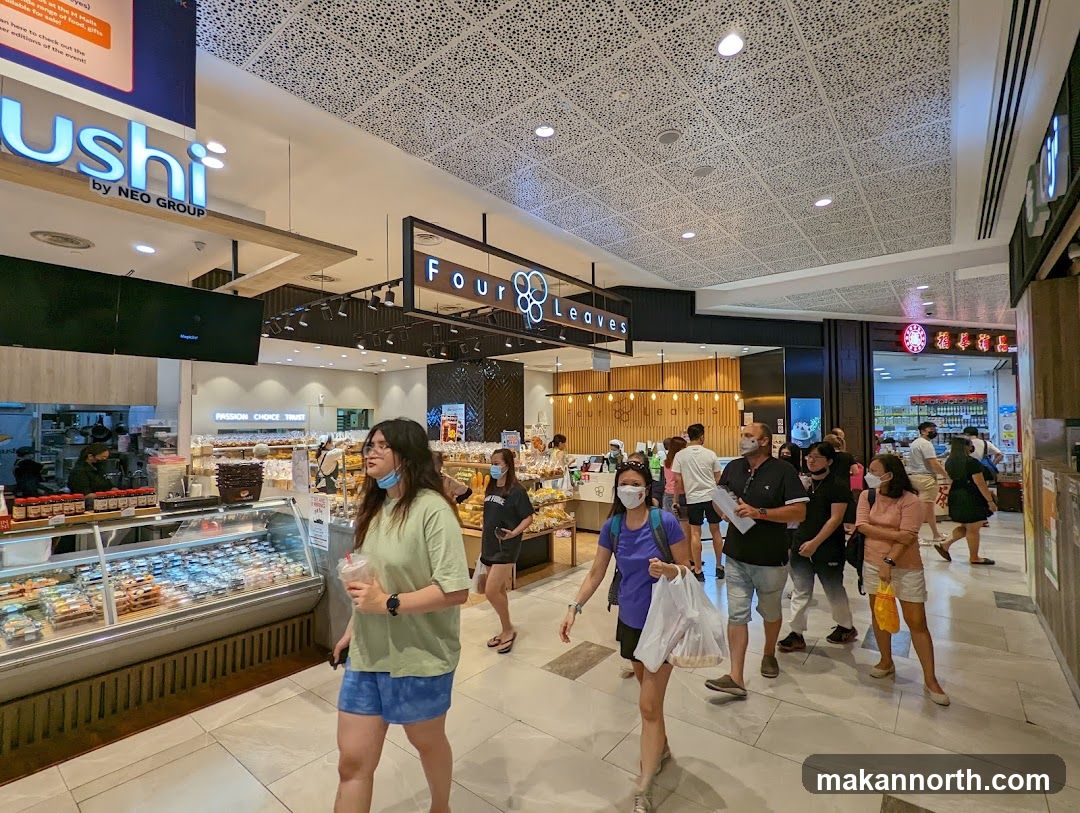 People walking in a mall with shops