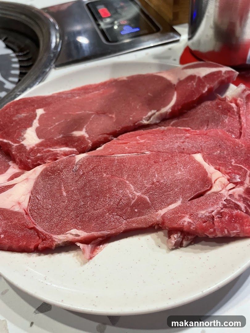 Raw Steaks on Plate
