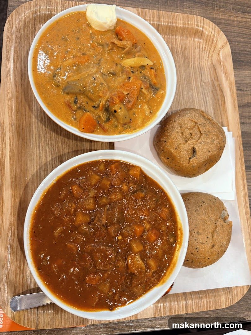 Two Bowls of Stew with Bread Rolls