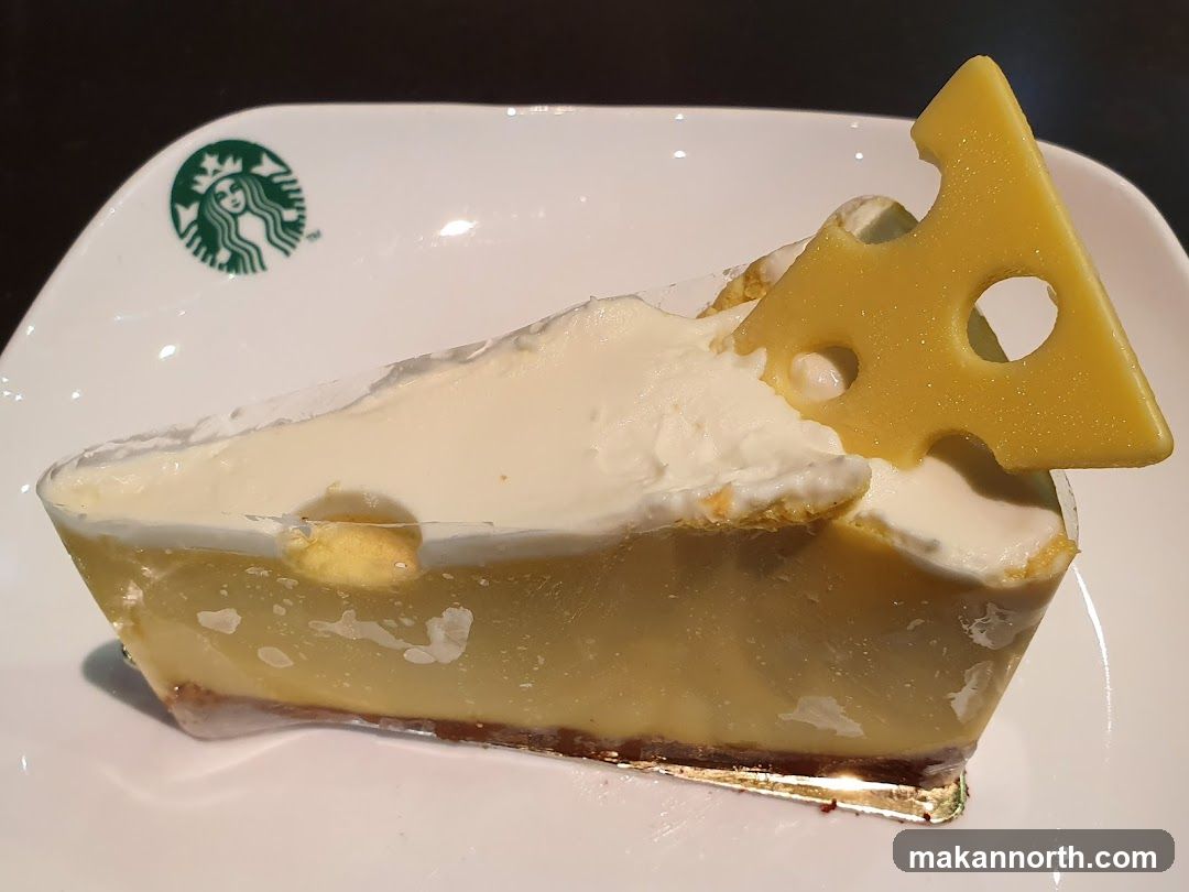 Cheesecake Slice with Cheese Garnish