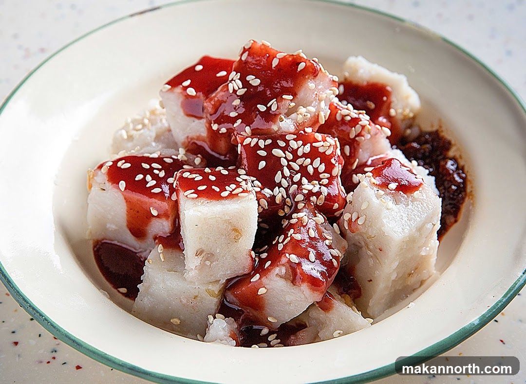 Savory Rice Cakes with Red Sauce and Sesame Seeds