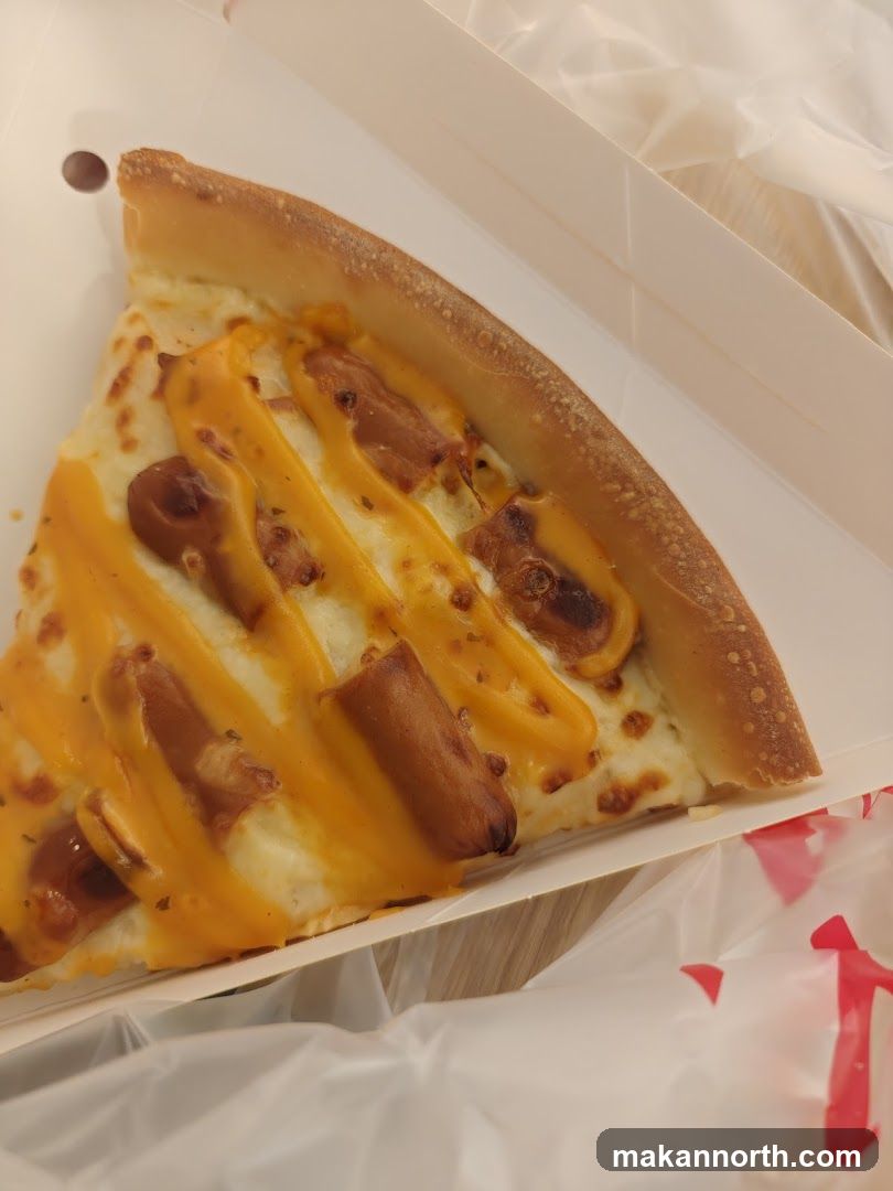 Slice of Pizza with Sausage and Cheese