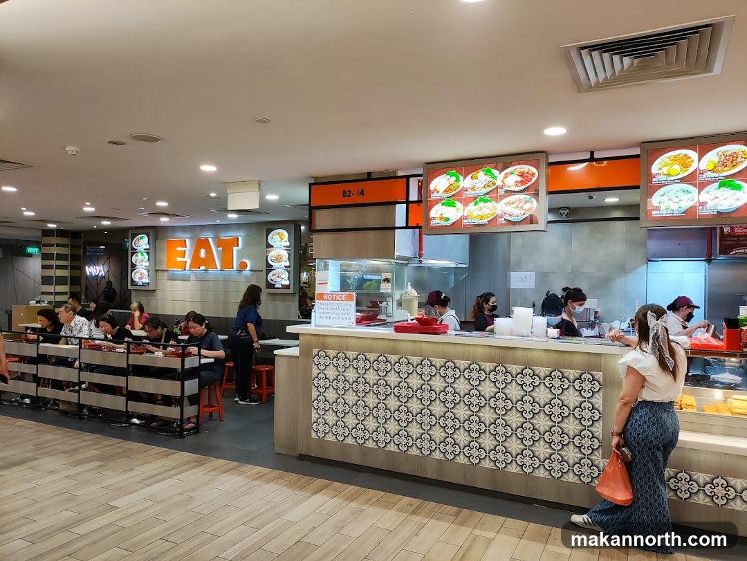 Food court with diners and food displays