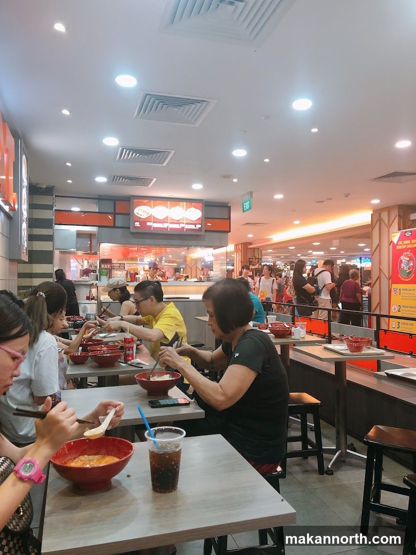 People eating at a food court