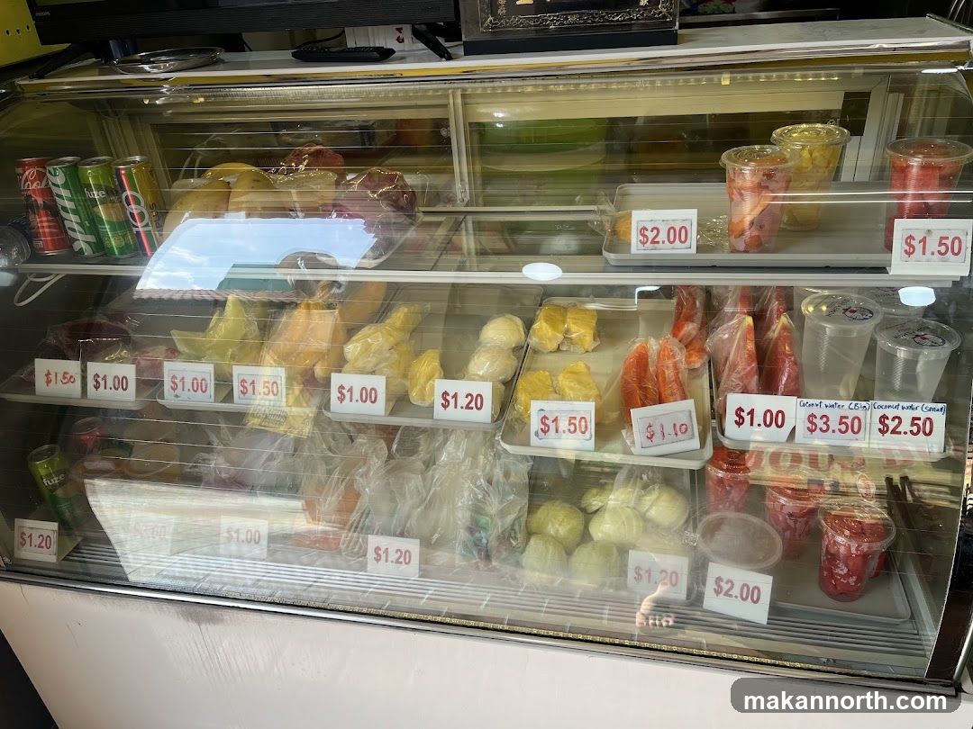 Refrigerated Display Case with Fruits and Drinks