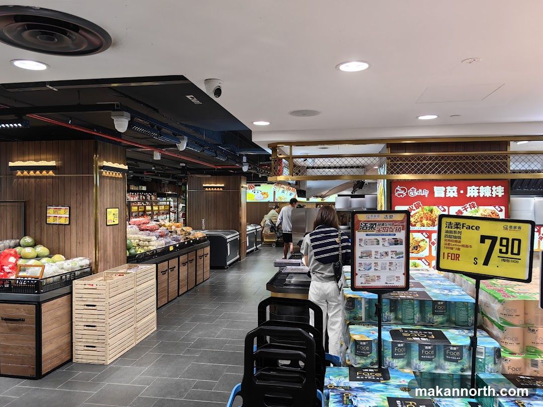 Supermarket aisle with produce and promotional displays