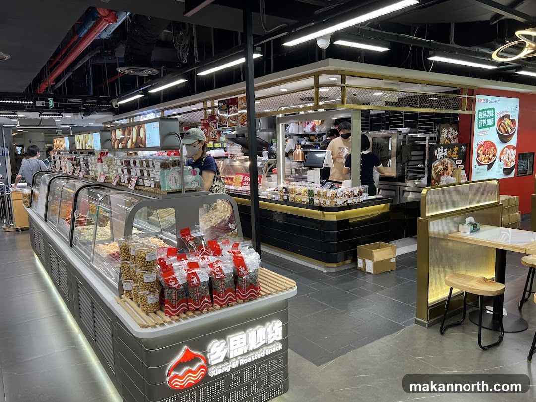 Snack shop interior with display cases and food items