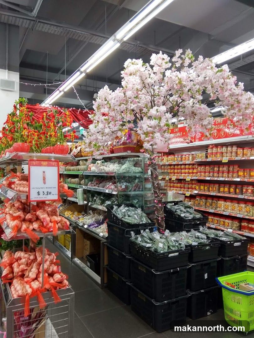 Supermarket aisle with festive decorations